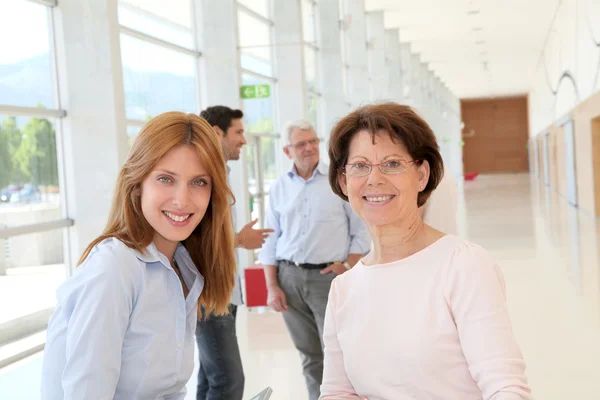 Portrait of smiling women in business training — Stock Photo, Image