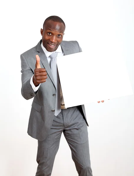 Businessman holding white message board — Stock Photo, Image