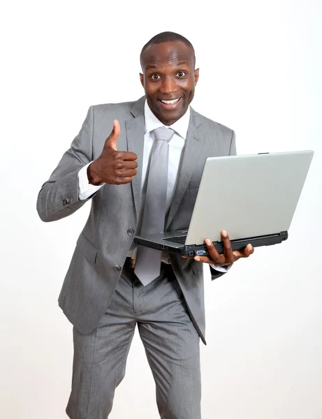 Hombre de negocios alegre con ordenador portátil —  Fotos de Stock