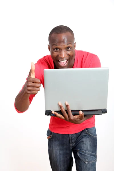 Homem alegre com laptop — Fotografia de Stock