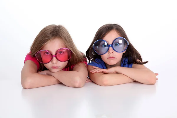 Portrait of girls doing funny faces Stock Picture
