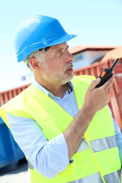 Site manager using walkie-talkie Royalty Free Stock Images