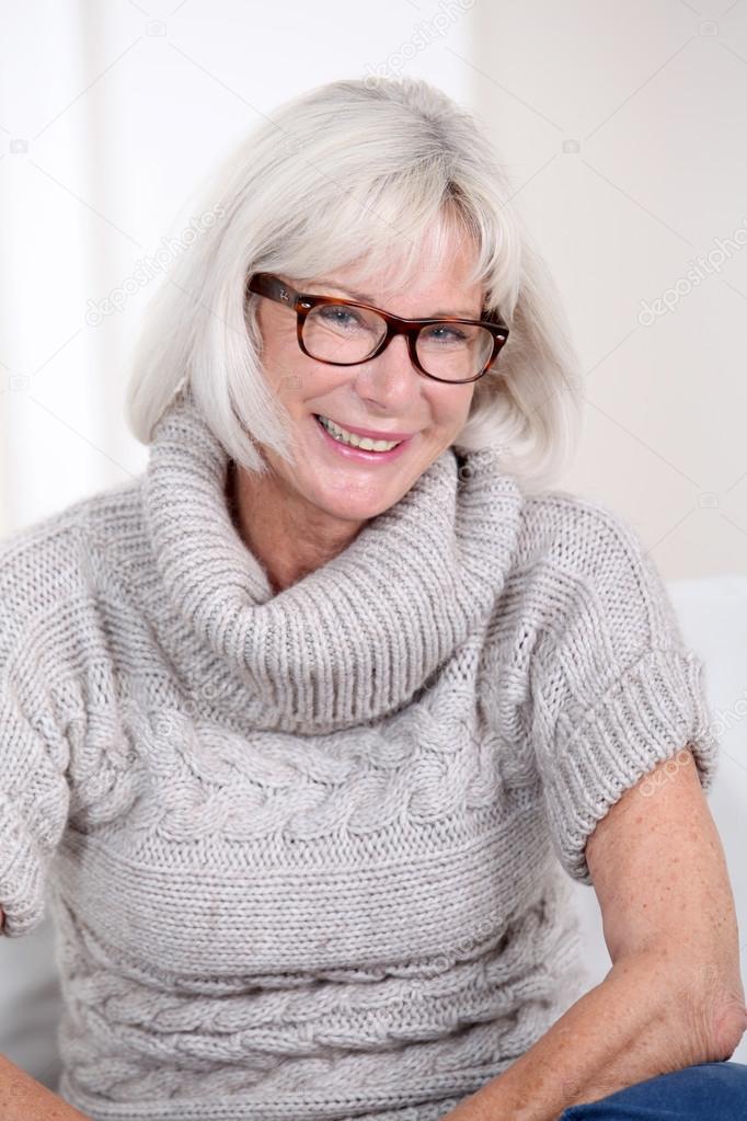 Portrait of smiling senior woman with eyeglasses