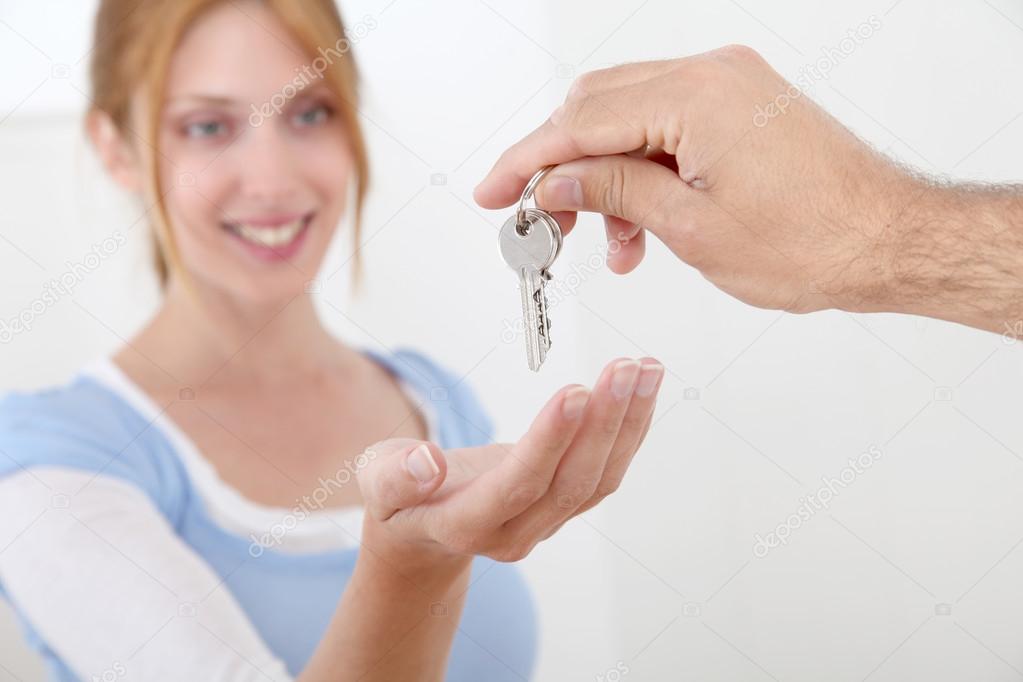 Woman getting keys of new home