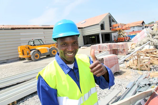 Construction worker on building site with security helmet — Stock Photo, Image