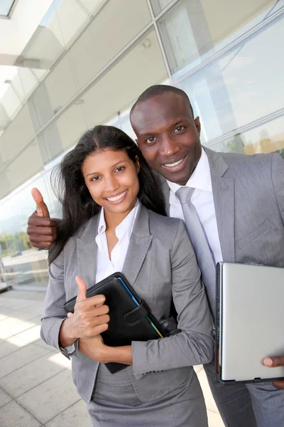 Business team standing outside congress center — Stock Photo, Image