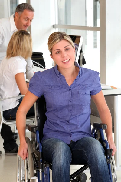 Closeup of young handicapped worker in the office — Stock Photo, Image