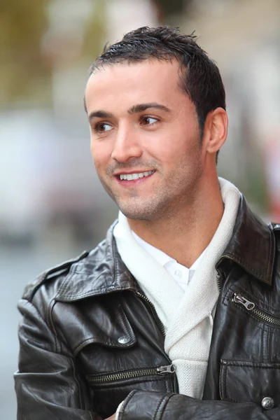 Closeup of man with leather jacket standing outside — Stock Photo, Image