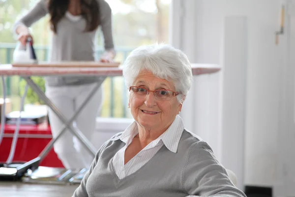 Closeup of elderly woman with home help — Stock Photo, Image