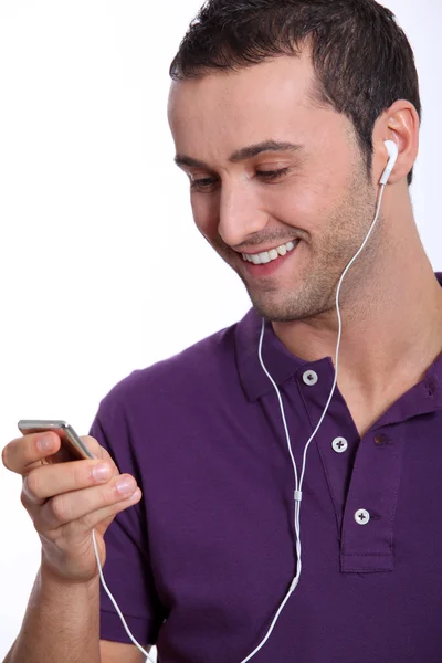 Young man with music player — Stock Photo, Image