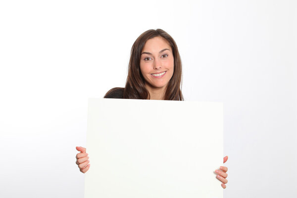 Woman in black dress showing message on white board