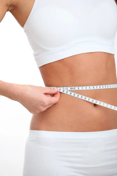 Closeup of tape measure around woman waist — Stock Photo, Image