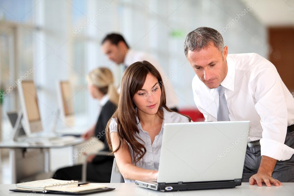 Manager and secretary working in the office Stock Photo by ©Goodluz 18225561