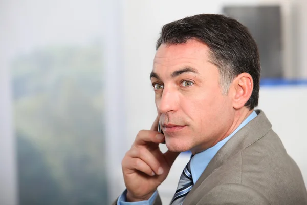 Closeup of businessman talking on the phone — Stock Photo, Image