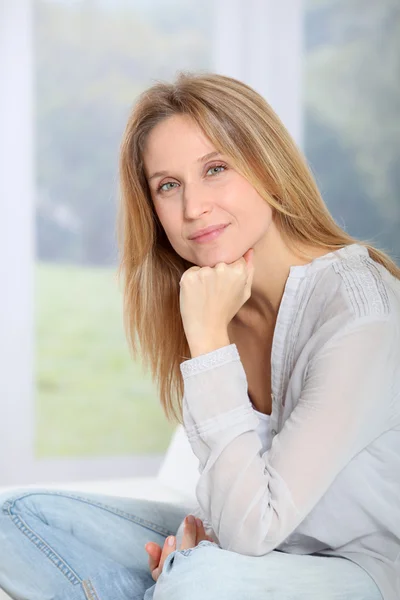 Closeup of beautiful blond woman relaxing at home — Stock Photo, Image