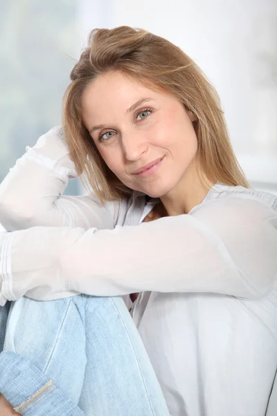 Closeup of beautiful blond woman relaxing at home — Stock Photo, Image