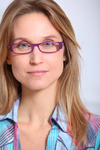 Closeup of beautiful blond woman wearing eyeglasses — Stock Photo, Image