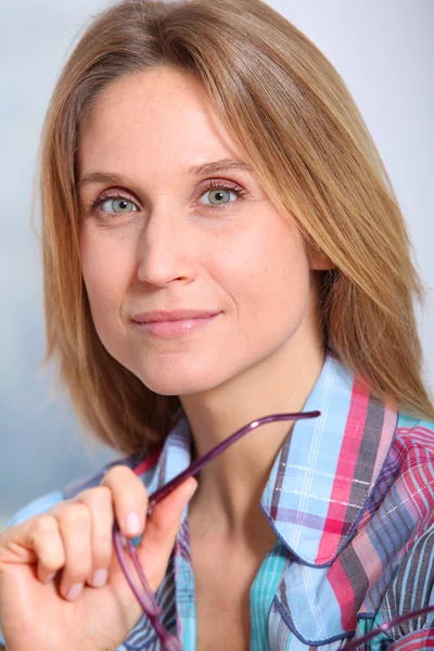 Closeup of beautiful blond woman wearing eyeglasses — Stock Photo, Image