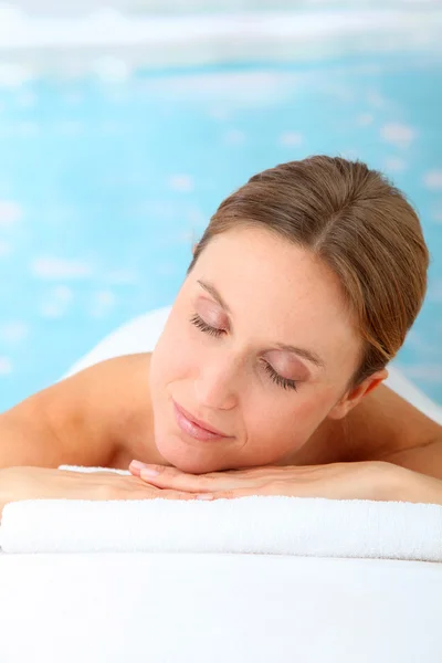 Closeup of beautiful blond woman on a massage bed — Stock Photo, Image