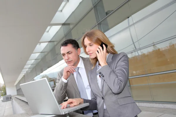 Sales working outside modern building — Stock Photo, Image