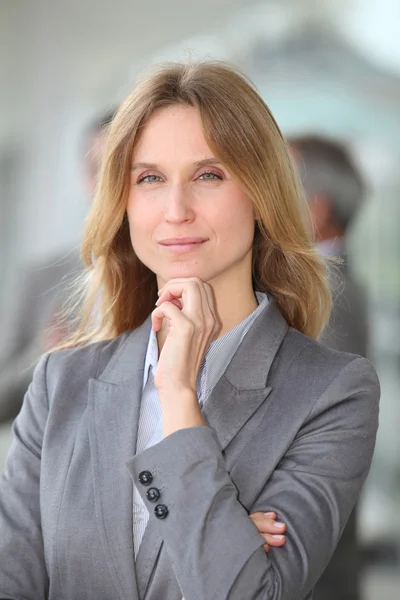 Closeup of blond businesswoman standing outside — Stock Photo, Image