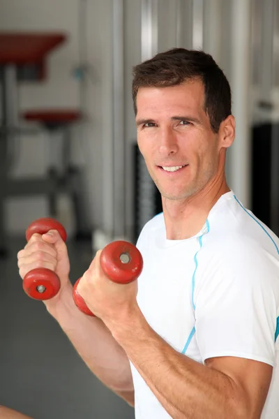 Closeup of man working out in gym — Stock Photo, Image
