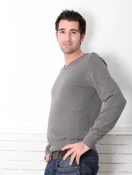 Young man leaning on white background — Stock Photo, Image