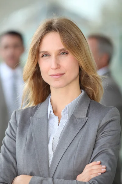 Closeup of blond businesswoman standing outside Stock Picture