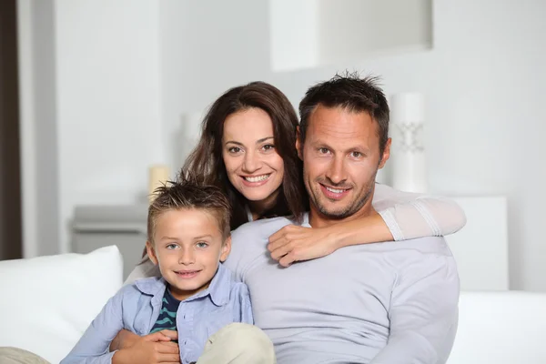 Closeup of parents and child relaxing at home on sofa — Stock Photo, Image