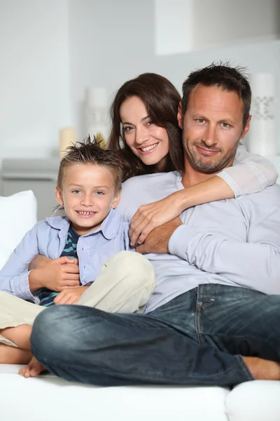 Closeup of parents and child relaxing at home on sofa — Stock Photo, Image