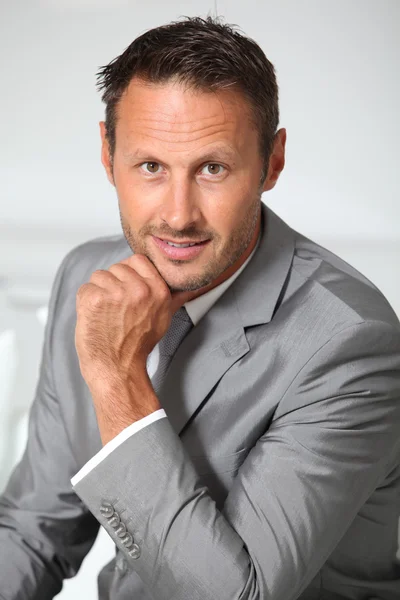 Closeup of businessman wearing grey suit — Stock Photo, Image