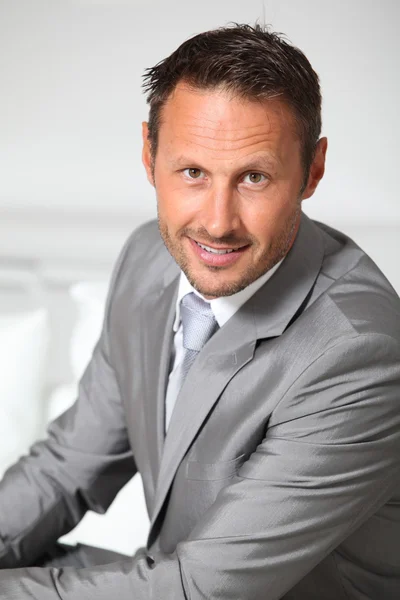 Closeup of businessman wearing grey suit — Stock Photo, Image