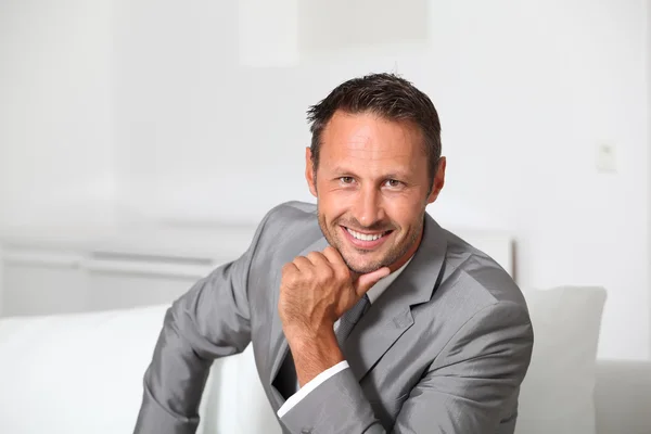 Closeup of businessman wearing grey suit — Stock Photo, Image