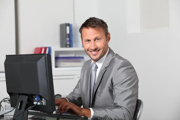 Closeup of businessman at his desk — Stock Photo, Image