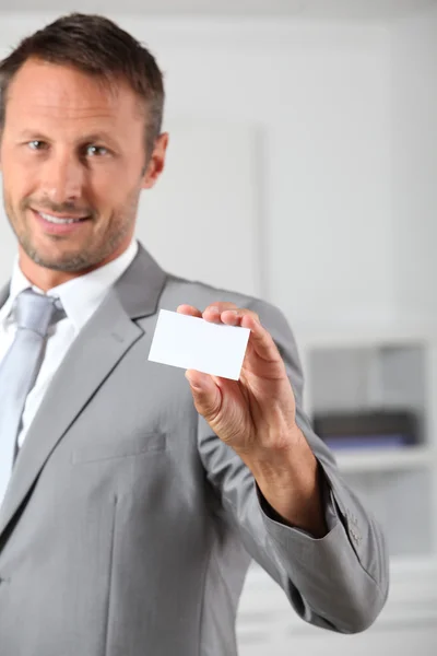 Businessman holding business card — Stock Photo, Image