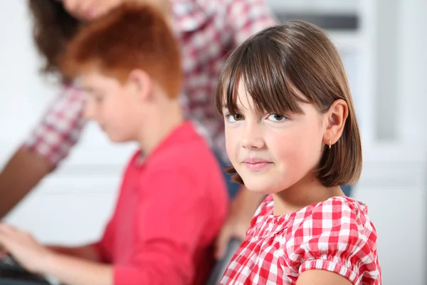 Shy little girl at school — Stock Photo, Image