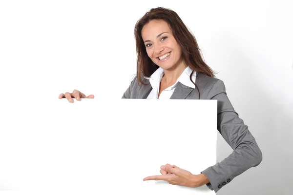 Businesswoman showing message board Stock Photo