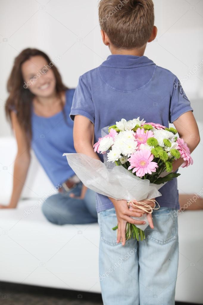 Little Boy Giving Flowers To His Mom On Mother S Day Stock Photo By C Goodluz 18263339