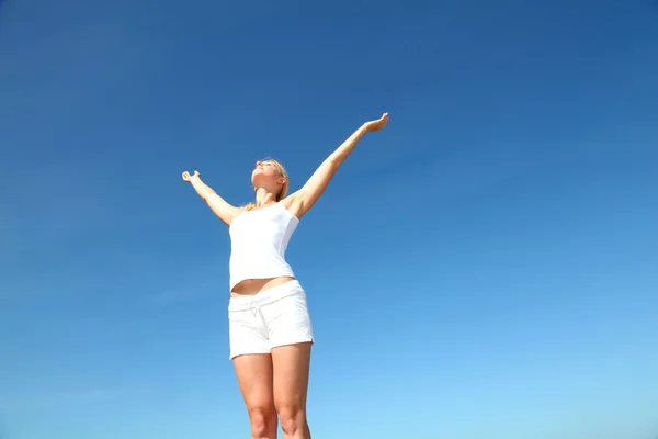 Woman stretching arms up from freedom — Stock Photo, Image