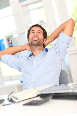 Relaxed businessman in office
