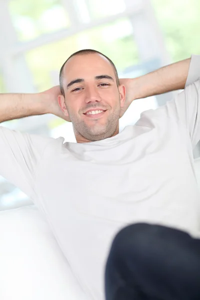 Handsome guy relaxing in sofa — Stock Photo, Image