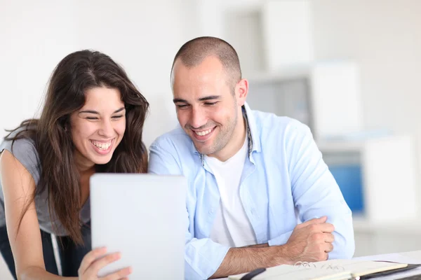 Workmates working on project with electronic tablet — Stock Photo, Image