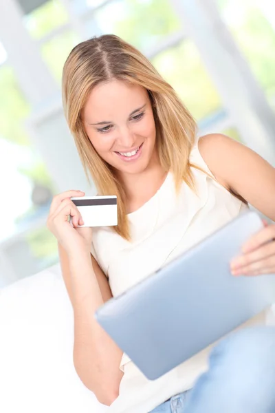 Young woman doing online shopping Stock Image