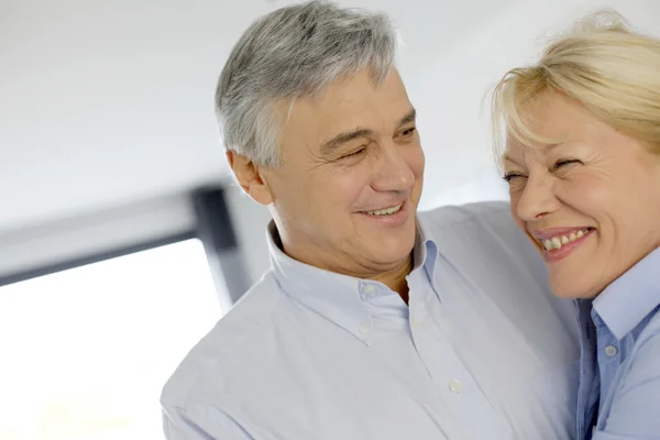 Portrait of cheerful senior couple at home — Stock Photo, Image