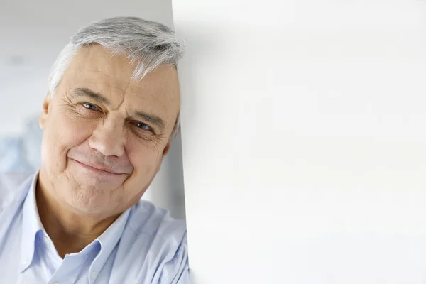 Portrait of serene senior man looking at camera — Stock Photo, Image