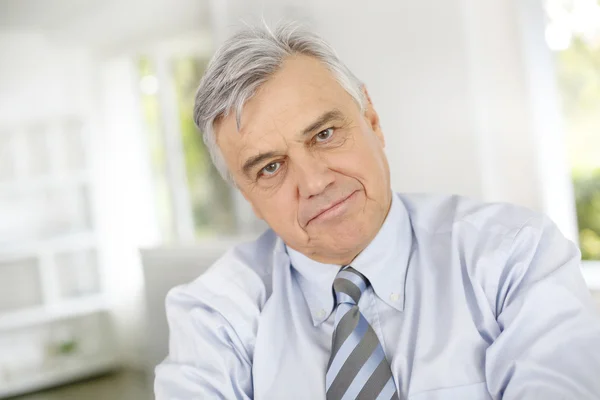 Portrait of senior businessman with serious look — Stock Photo, Image