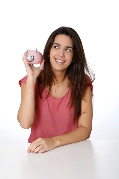 Cheerful girl holding piggy bank — Stock Photo, Image