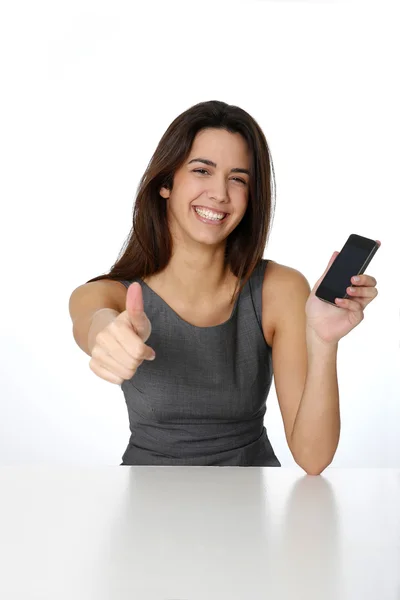 Young woman with smartphone showing thumb up — Stock Photo, Image