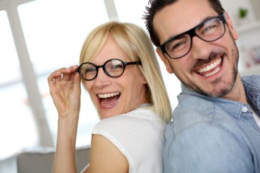 Middle-aged couple wearing eyeglasses
