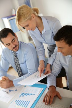 Corporate woman presenting results to sales team